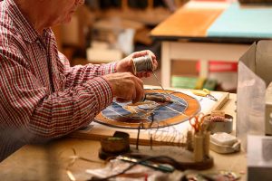 A Clark Retirement Community resident works on an art project.