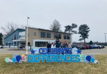 Business owner raising autism awareness through yard sign